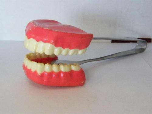 False teeth ice tongs