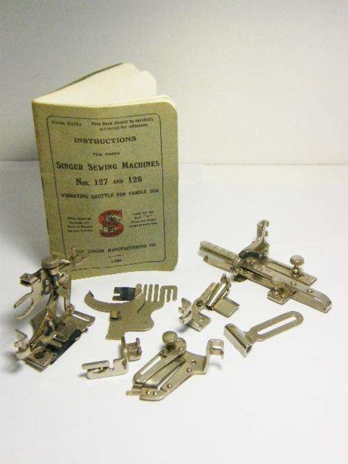 Singer sewing machine parts with booklet - as per photo