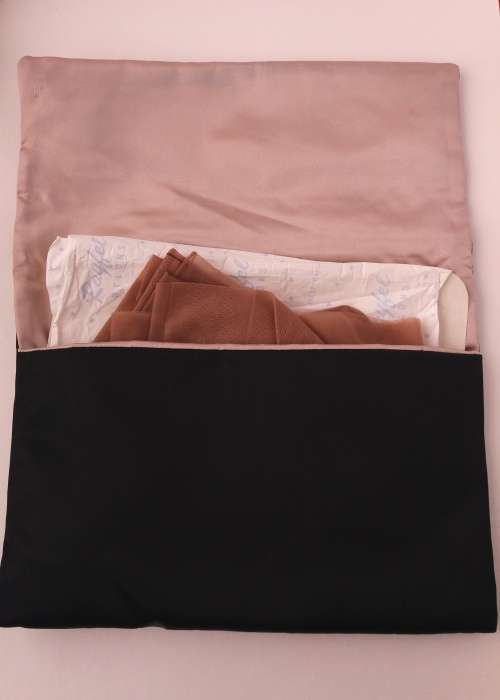 1950s rayon stockings in black satin evening bag