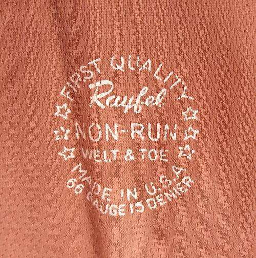 1950s rayon stockings in black satin evening bag