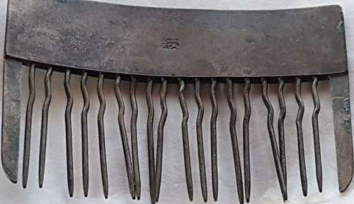 Antique Chinese silver hair comb with a dragon scene