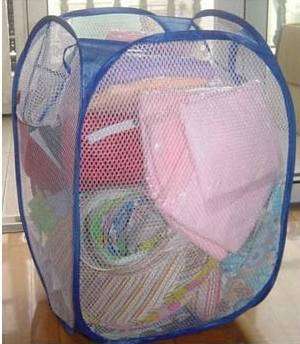 Pop up travel laundry basket. Folds up into a small disk.