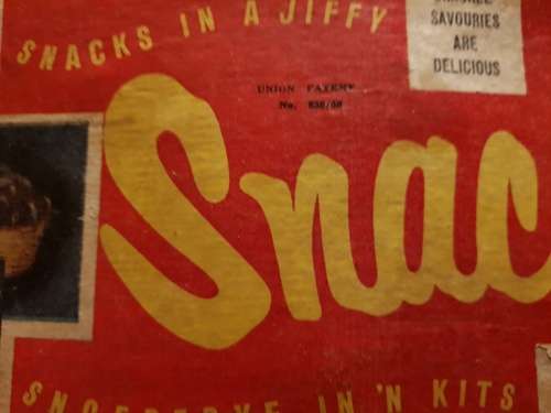 Vintage Snackle in its original box with instructions
