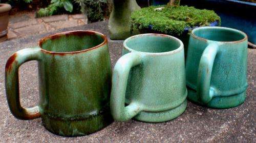 THREE BEAUTIFUL GREEN POTTERY TANKARDS