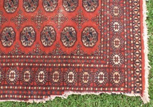 Bukhara hand woven carpet - lovely old character piece - worn, faded, threadbare in places