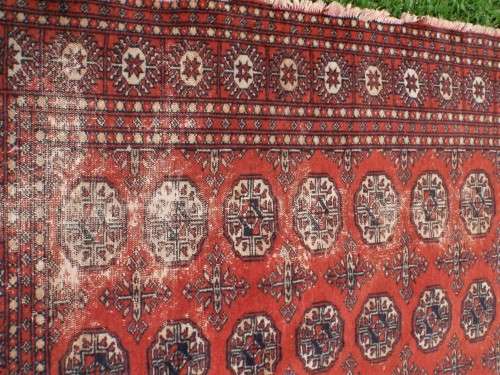Bukhara hand woven carpet - lovely old character piece - worn, faded, threadbare in places