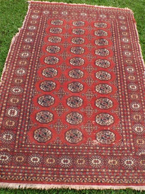 Bukhara hand woven carpet - lovely old character piece - worn, faded, threadbare in places