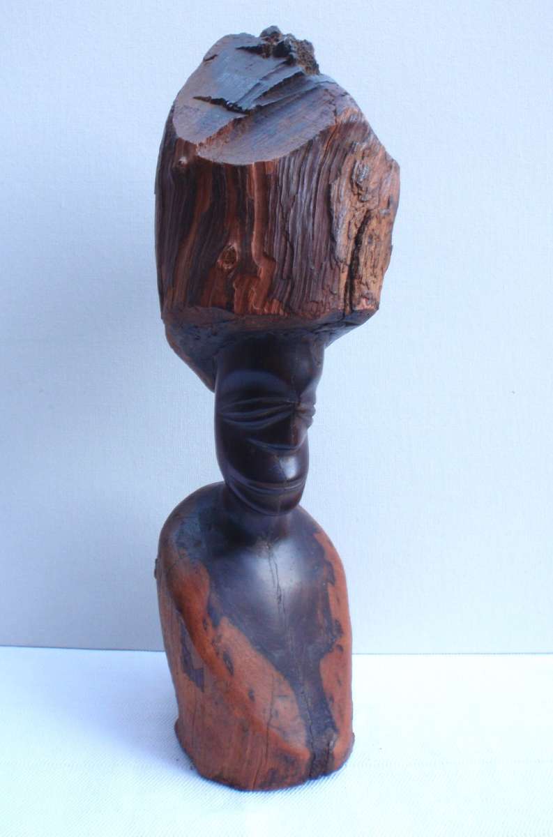 Authenic African wood carving.  Interesting, unique avant-garde dimensions and use of wood.