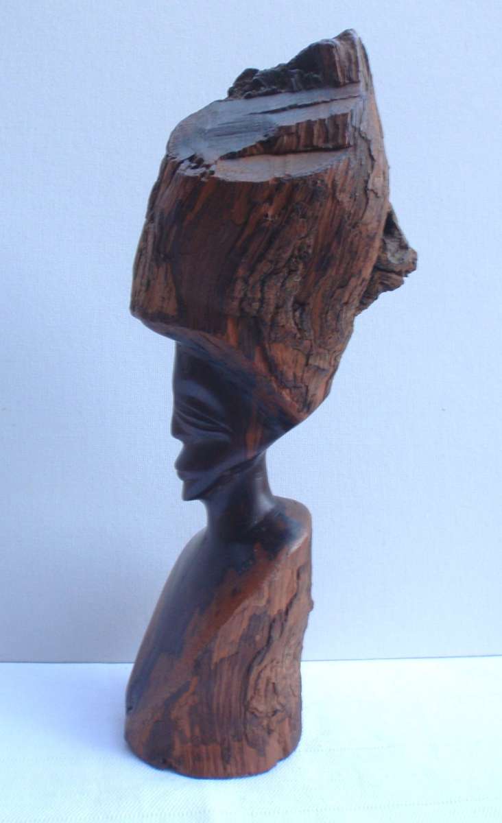 Authenic African wood carving.  Interesting, unique avant-garde dimensions and use of wood.