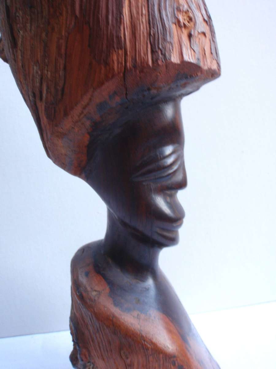 Authenic African wood carving.  Interesting, unique avant-garde dimensions and use of wood.