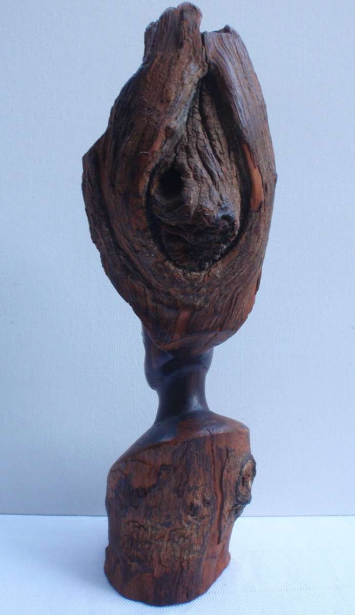 Authenic African wood carving.  Interesting, unique avant-garde dimensions and use of wood.