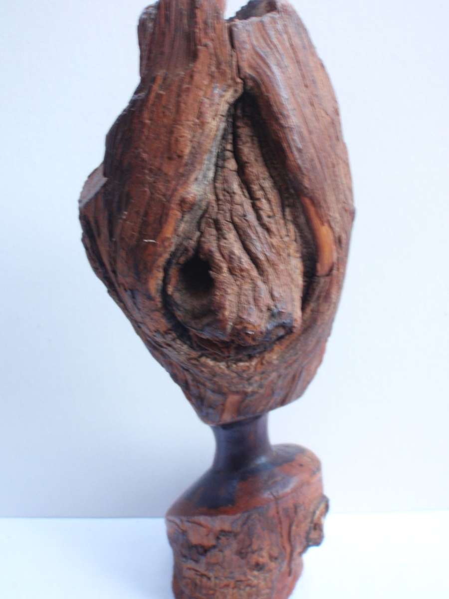 Authenic African wood carving.  Interesting, unique avant-garde dimensions and use of wood.