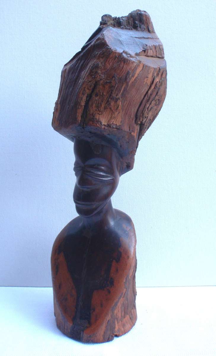 Authenic African wood carving.  Interesting, unique avant-garde dimensions and use of wood.