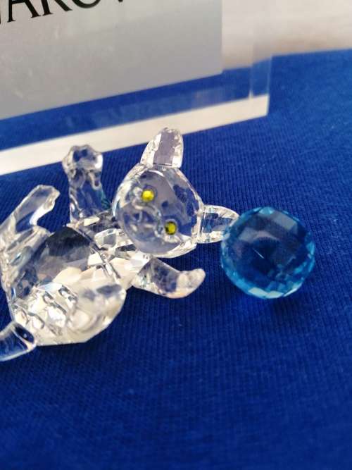 Swarovski Crystal Kitten playing with a blue ball of wool