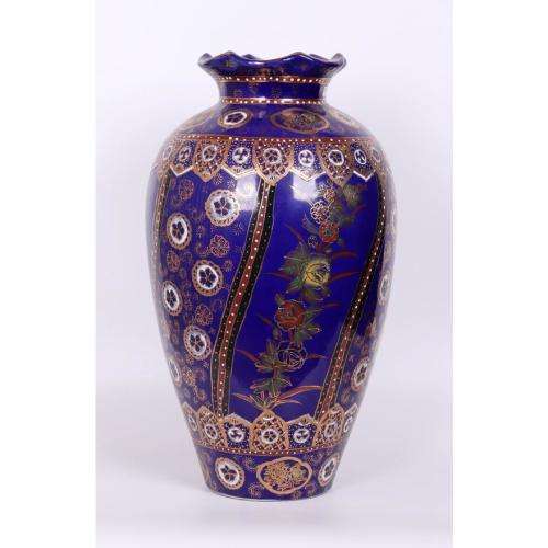 Large Japanese blue-ground vase decorated with floral panels and rondels