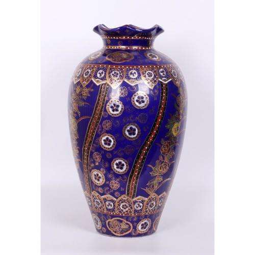 Large Japanese blue-ground vase decorated with floral panels and rondels