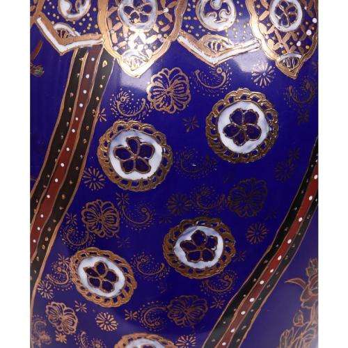 Large Japanese blue-ground vase decorated with floral panels and rondels