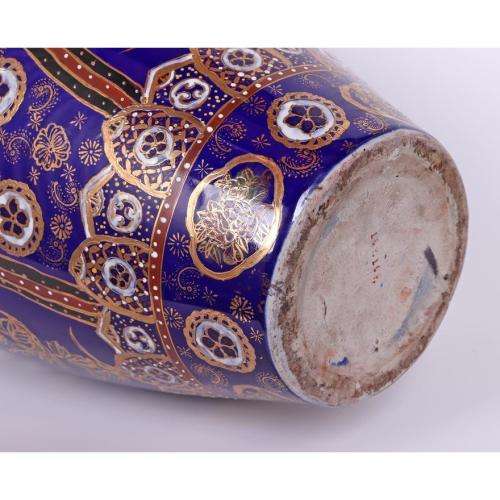 Large Japanese blue-ground vase decorated with floral panels and rondels