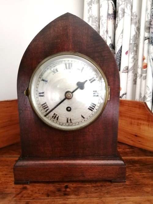 English Tame Side Single Chain Fusee brass bezel in an oak lancet shape case. Mantel Clock