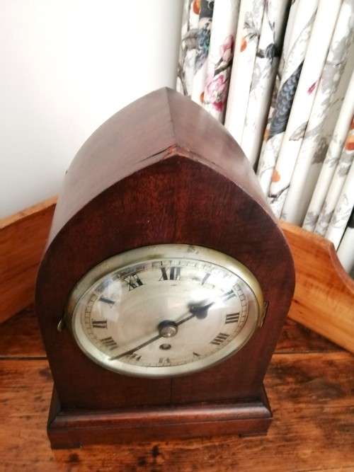 English Tame Side Single Chain Fusee brass bezel in an oak lancet shape case. Mantel Clock