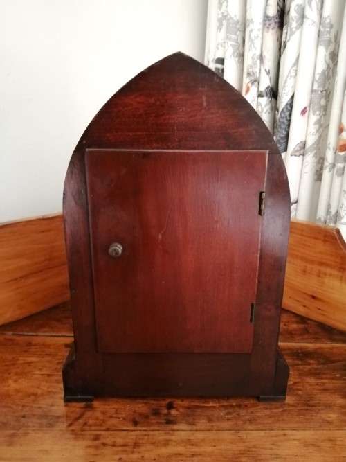 English Tame Side Single Chain Fusee brass bezel in an oak lancet shape case. Mantel Clock