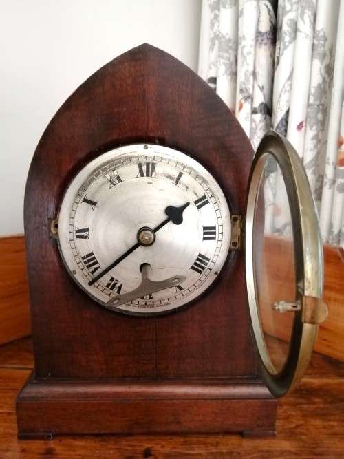 English Tame Side Single Chain Fusee brass bezel in an oak lancet shape case. Mantel Clock