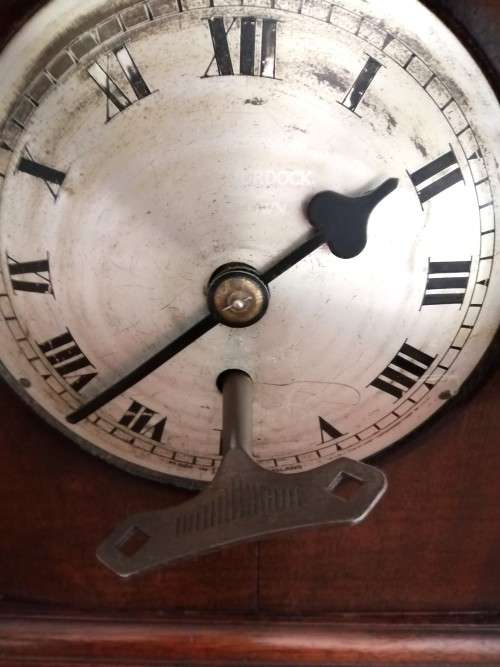 English Tame Side Single Chain Fusee brass bezel in an oak lancet shape case. Mantel Clock