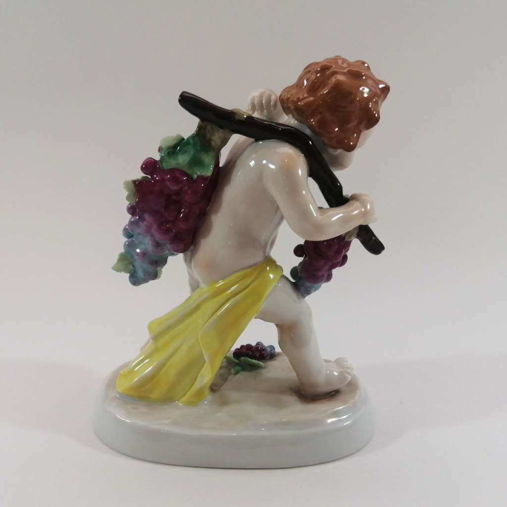 German Sitzendorf Figurine Depicting a Putto Carrying Grapes