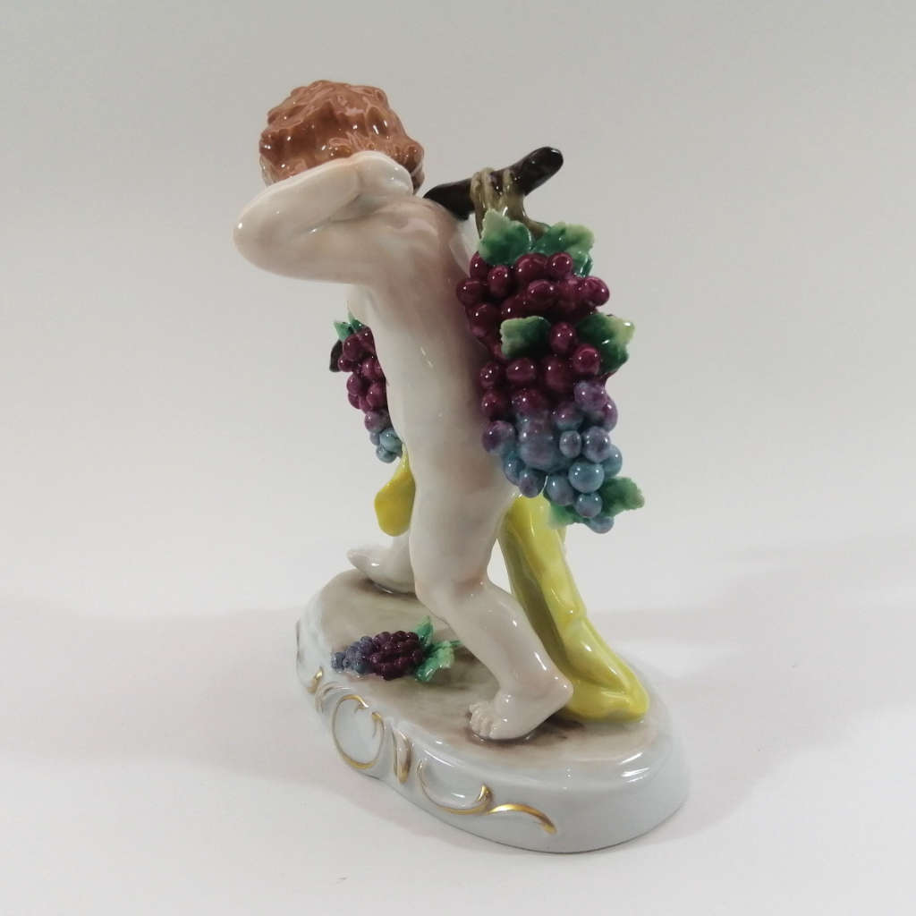 German Sitzendorf Figurine Depicting a Putto Carrying Grapes