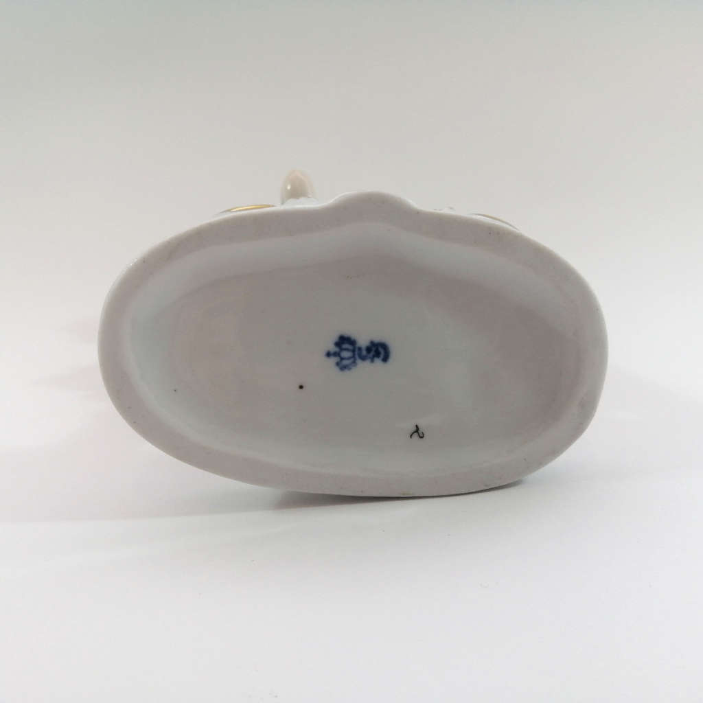 German Sitzendorf Figurine Depicting a Putto Carrying Grapes