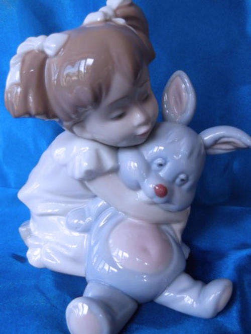 lladro Nao  Girl hugging toy rabbit