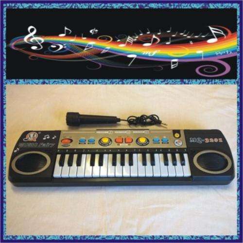 ELECTRONIC KEYBOARD - 32 KEYS - 3 Tones Select, 8 Rhythm Select, Sound Effect, Volume Control. WOW!!