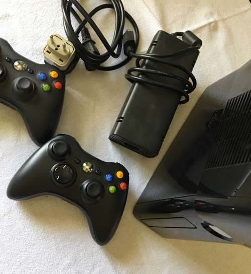 Xbox 360 Slim with 2 controllers