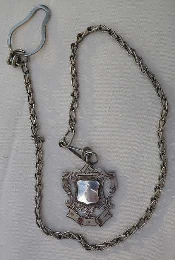 Hallmarked silver watch fob on metal fob chain. London.