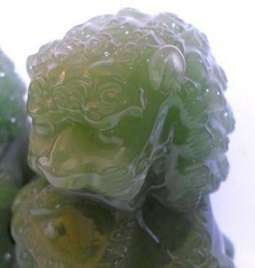 Superb pair of large green Chinese Peking Glass Temple Foo Dogs on camphor wood stands