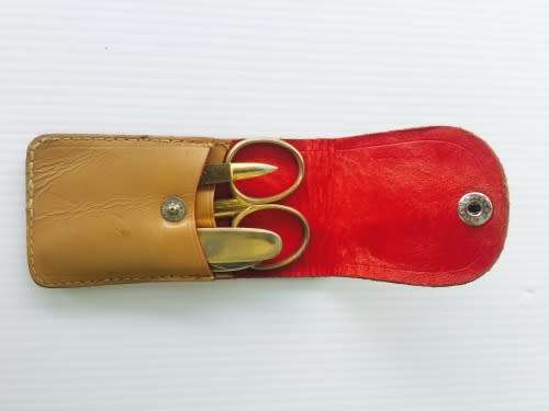 Quality vintage German travelling manicure set in leather case. Scissors, pocket knife & nail file.