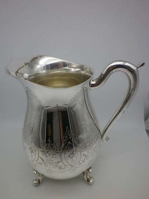 LARGE SILVER PLATED VINTAGE  JUG WITH ICE LIP LOVELY CHASED DECORATION. EXCELLENT CONDITION 20CM