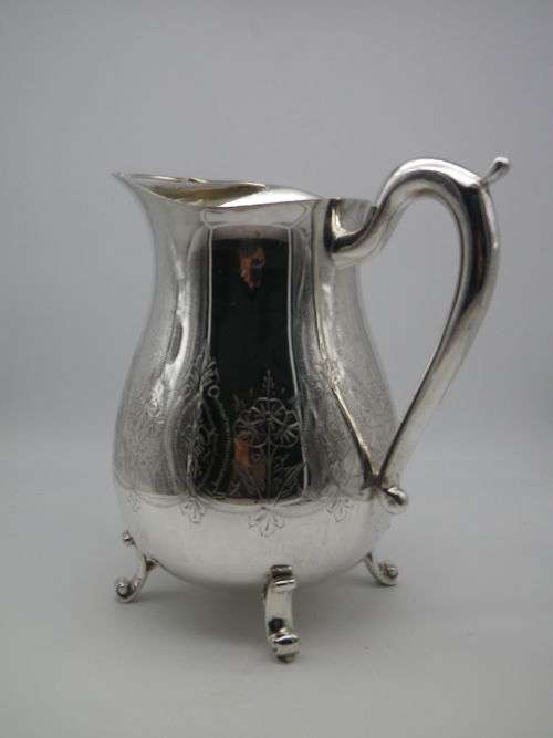LARGE SILVER PLATED VINTAGE  JUG WITH ICE LIP LOVELY CHASED DECORATION. EXCELLENT CONDITION 20CM