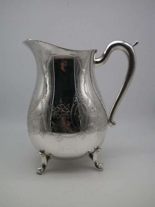 LARGE SILVER PLATED VINTAGE  JUG WITH ICE LIP LOVELY CHASED DECORATION. EXCELLENT CONDITION 20CM