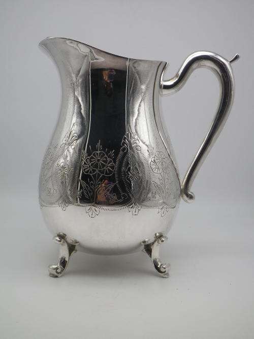 LARGE SILVER PLATED VINTAGE  JUG WITH ICE LIP LOVELY CHASED DECORATION. EXCELLENT CONDITION 20CM