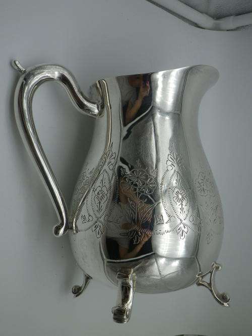 LARGE SILVER PLATED VINTAGE  JUG WITH ICE LIP LOVELY CHASED DECORATION. EXCELLENT CONDITION 20CM