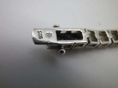 Sterling Silver tennis bracelet set with princess cut cubic zirconias. 20 cm 20.3 grms