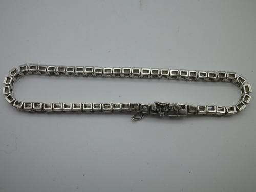 Sterling Silver tennis bracelet set with princess cut cubic zirconias. 20 cm 20.3 grms