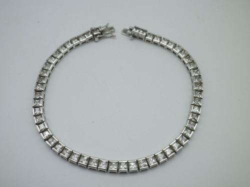 Sterling Silver tennis bracelet set with princess cut cubic zirconias. 20 cm 20.3 grms