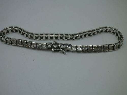 Sterling Silver tennis bracelet set with princess cut cubic zirconias. 20 cm 20.3 grms