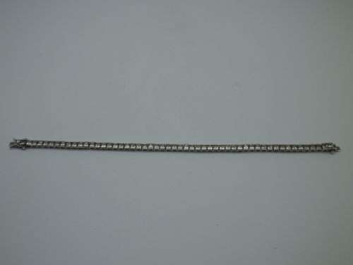 Sterling Silver tennis bracelet set with princess cut cubic zirconias. 20 cm 20.3 grms