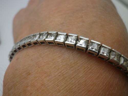 Sterling Silver tennis bracelet set with princess cut cubic zirconias. 20 cm 20.3 grms