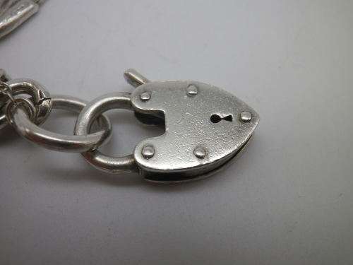 Sterling Silver Vintage Charm bracelet. Hallmarked clasp. Heavy Rare charm. 72grms Excellent quality