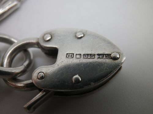 Sterling Silver Vintage Charm bracelet. Hallmarked clasp. Heavy Rare charm. 72grms Excellent quality