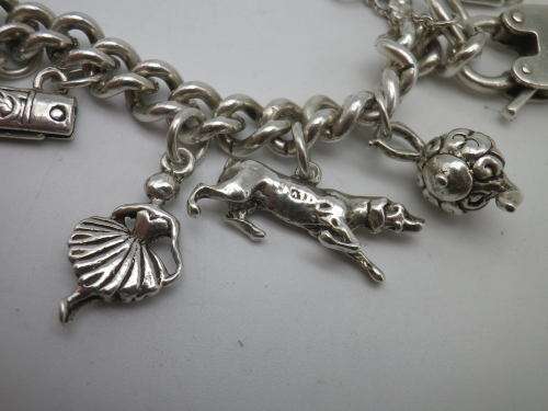 Sterling Silver Vintage Charm bracelet. Hallmarked clasp. Heavy Rare charm. 72grms Excellent quality